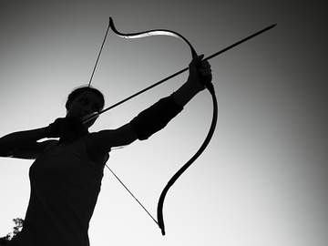 archer aiming bow and arrow
